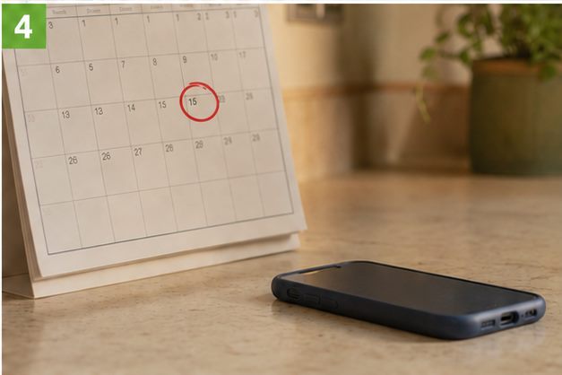 Calendar with the booked date circled, phone on the counter